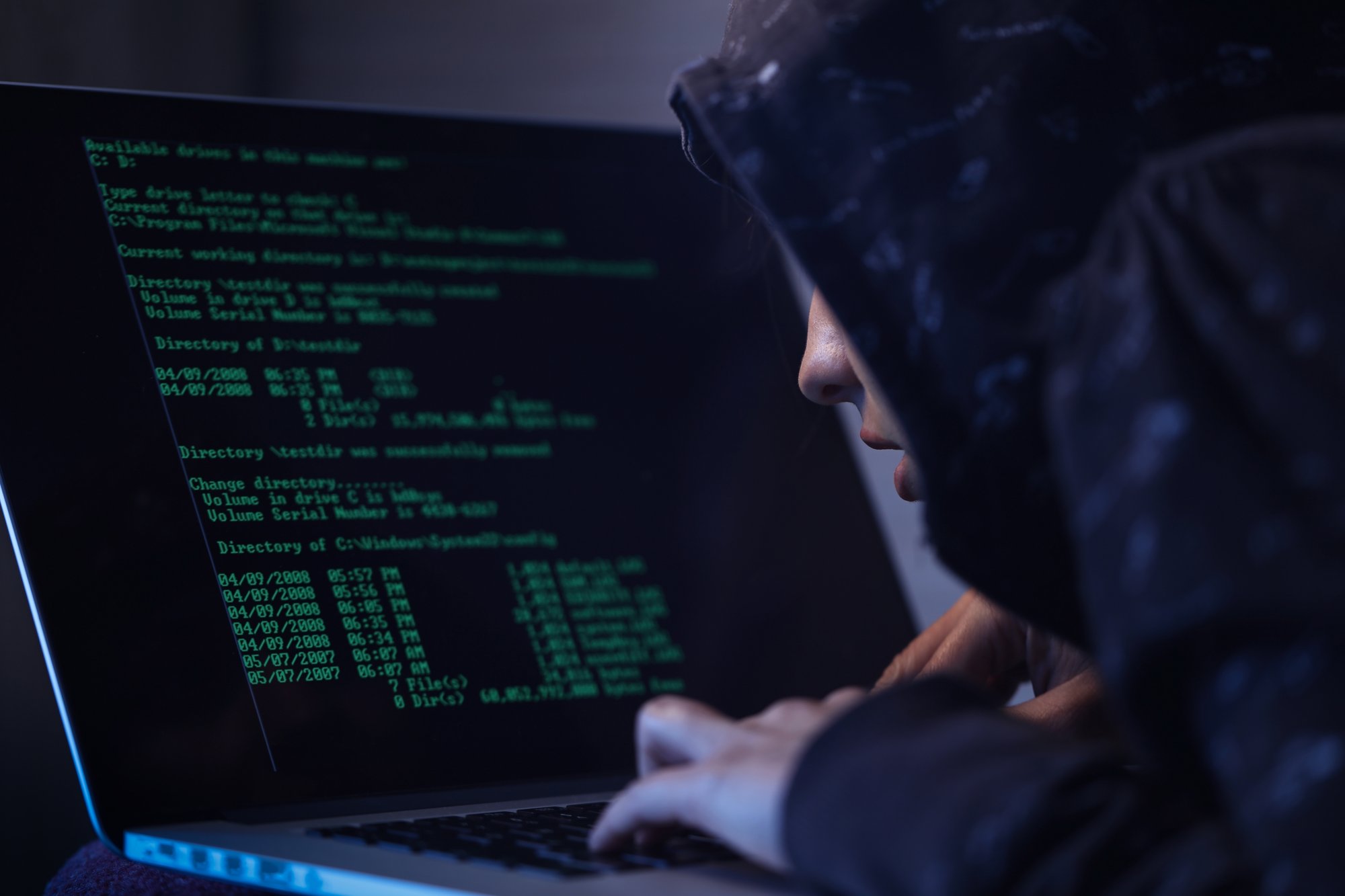 computer-hacker-hooded-shirt-typing-software-algorithms-stealing-data-from-computer-network-laptop